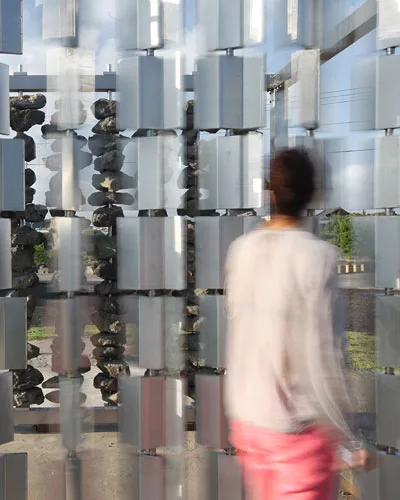 For a permanent installation on Jeju Island off the south tip of Korea, the architects collaborated with scientists at the Korea Institute of Energy Research, building a pair of facing walls—one
