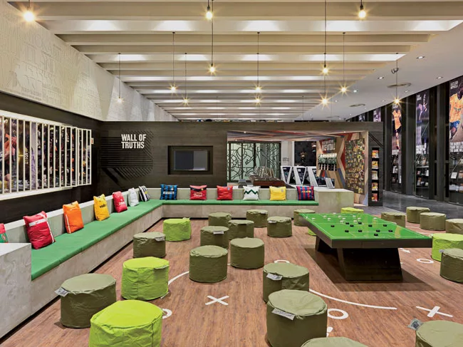 Interiors blend commercial images from Nike with social spaces for players.