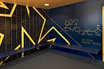 In a renovated structure behind the new building, RUFproject worked with the graphic design agency Grid Worldwide to stamp each dressing room with the logos and colors of famous football teams sponsor