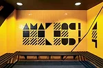 In a renovated structure behind the new building, RUFproject worked with the graphic design agency Grid Worldwide to stamp each dressing room with the logos and colors of famous football teams sponsor