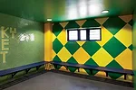 In a renovated structure behind the new building, RUFproject worked with the graphic design agency Grid Worldwide to stamp each dressing room with the logos and colors of famous football teams sponsor