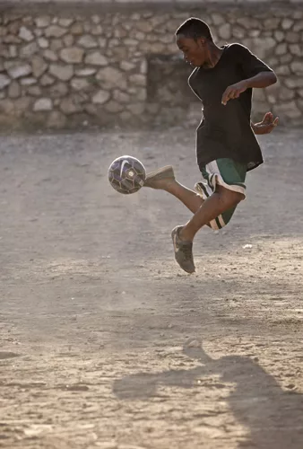 A boy practices his ball-handling skills. <em>January 2012</em>.