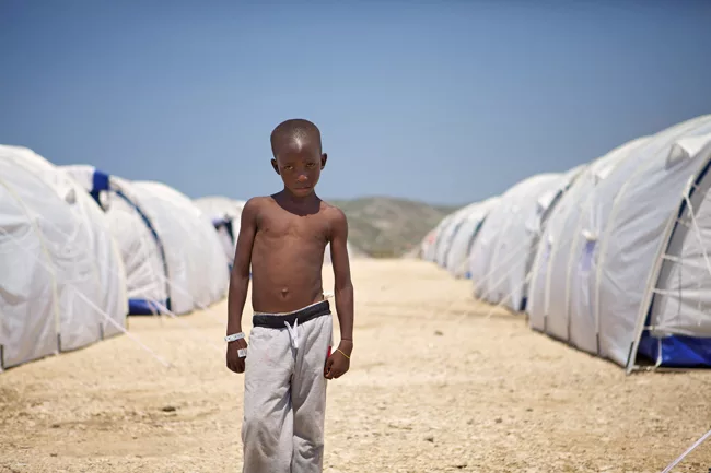 A boy at Corail-Cesselesse, a resettlement camp in a desolate area outside of Port-au-Prince. <em>April 2010</em>.