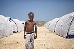 A boy at Corail-Cesselesse, a resettlement camp in a desolate area outside of Port-au-Prince. <em>April 2010</em>.