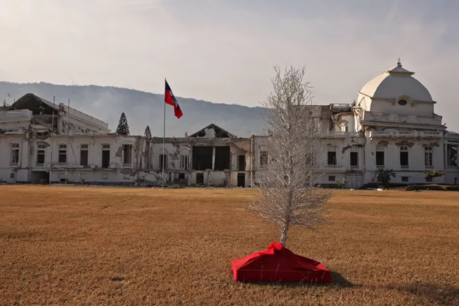 Remnants of holiday d'cor sit on the lawn of the Presidential Palace, which remains a ruin. <em>January 2012</em>.