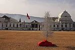 Remnants of holiday d'cor sit on the lawn of the Presidential Palace, which remains a ruin. <em>January 2012</em>.