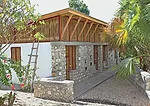 Stones used for the foundation walls and entrance facade were collected from a nearby riverbed.