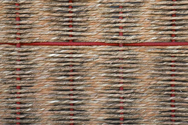 Window and door screens are made of woven grass.