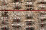 Window and door screens are made of woven grass.