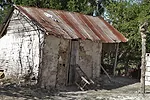 Next to the school are rustic homes.