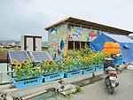Because of the acute labor and equipment shortage, the building was assembled from a precut system. It serves as a preparation area where fishing nets and other equipment are readied, as well as a com