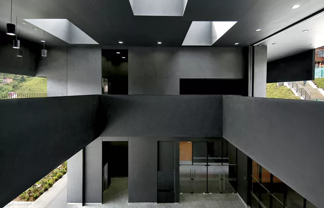 The open-air vestibule looks down to the entry atrium, soon to house a cat sculpture donated by Botero.