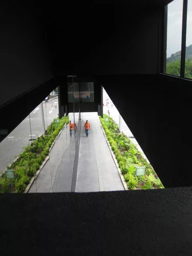 Apertures offer surprising views through and out of the building. Here, visitors get a look down to the protected exterior passage on the front facade.