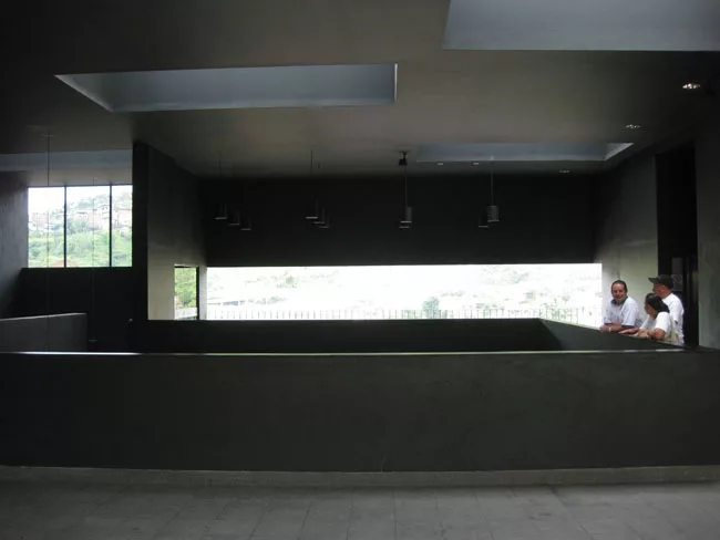 Visitors enter the open-air vestibule from the footpath that runs along the back of the building. The vestibule looks down to the entry atrium below, and soon will house a cafe.