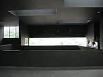 Visitors enter the open-air vestibule from the footpath that runs along the back of the building. The vestibule looks down to the entry atrium below, and soon will house a cafe.