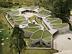 The building celebrates the rooftop'highly visible in this city of steep hillside communities. Though they designed planted roofs, the designers settled for artificial turf when the city nixed the pla