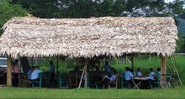 Before the upgrade, a thatched-roof, open-air schoolhouse sat on this site.