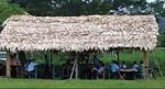 Before the upgrade, a thatched-roof, open-air schoolhouse sat on this site.