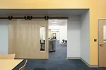 Sliding doors between classrooms are intended to facilitate collaboration among teachers. 