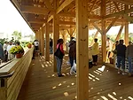 Farmers, craftsmen, and the public using the market.