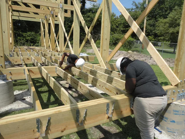 Students setting joists on the Windsor super market structure.