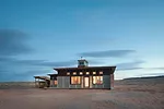 Handmade sliding clerestory windows and 10 recycled operable windows assist with natural ventilation. 