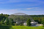 An R. Buckminster Fuller geodesic dome rises over a renovated and restored John Terence Kelly 1959 office building, home to ASM International, a member-led society for the materials science and engine