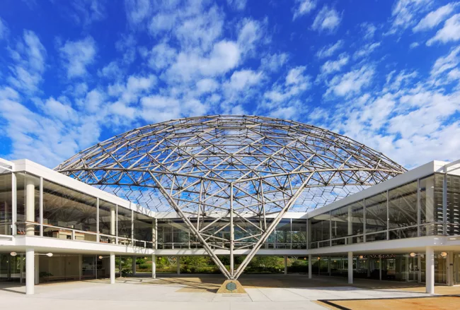 An R. Buckminster Fuller geodesic dome rises over a renovated and restored John Terence Kelly 1959 office building, home to ASM International, a member-led society for the materials science and engine