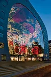 The Markthal sits on the site where Rotterdam originated in 1270 with the construction of a dam on the river Rotte. The stone that clads the building is the same as that used to pave the surrounding B