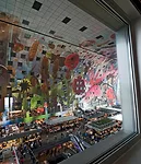 The interior-facing apartments have windows looking down on the activity of the market floor below.