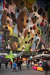 The market has 96 stalls, selling goods such as produce, cheese, wine, and meats. The complex also houses restaurants and retail, as well as a supermarket and four levels of parking.