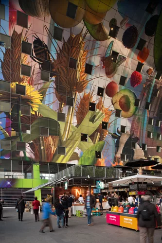 The market has 96 stalls, selling goods such as produce, cheese, wine, and meats. The complex also houses restaurants and retail, as well as a supermarket and four levels of parking.