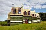 Tiles cover the westward-facing side of the house. 