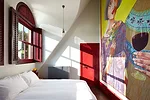 The tapestry 'Julie and Rob' hangs on a bedroom wall.
