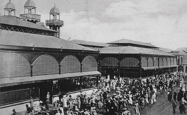 The building, known locally as the March' Hyppolite, served as a vital retail hub for more than a century. The building comprises two 20,000-square-foot halls. Rising 35 feet at their highest points,