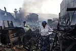 Despite extensive earthquake damage, merchants would eventually move back into the area, setting up stalls on the clogged streets.