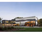 Like a cook using seasonal food, Gang switched to expressed concrete after losing a masonry donation. 