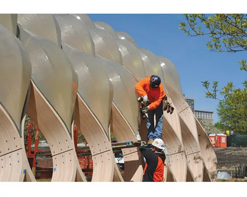 Like nomads setting up a tent, two workers, without heavy equipment, assembled the structure's lightweight, prefabricated parts in a day.