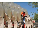 Like nomads setting up a tent, two workers, without heavy equipment, assembled the structure's lightweight, prefabricated parts in a day. 