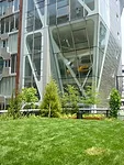 Lawn and south fa'ade of High Line 23 by Neil M. Denari Architects
