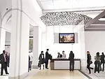 The 3,400-square-feet Great Hall has been redesigned as one large space encompassing a gallery, admissions area, and orientation signage. The black and white mural from Keith Haring's original New Yor