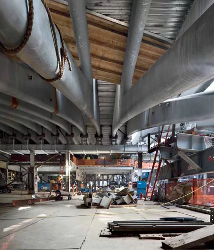 The roof's steel arches curve in two directions, as evident when standing on the construction platform of the PATH mezzanine looking north.
