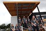 Chelsea Royall, front, team design director of Appalachian State University, talks about her team's house'<em>The Solar Homestead</em>'during a media preview on September 21. 