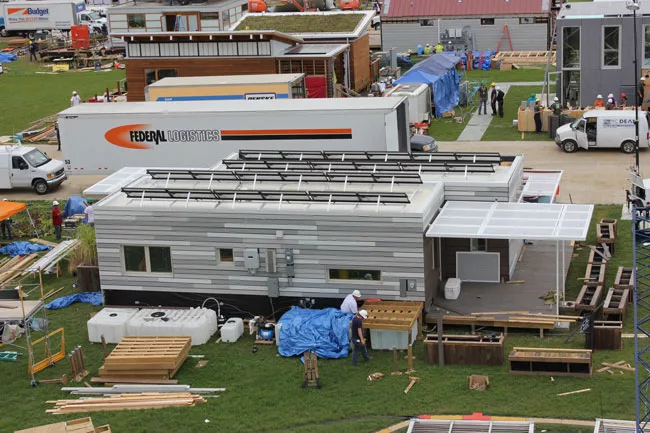 View of <em>Re_home</em>, by the University of Illinois at Urbana-Champaign, during assembly. The dwelling is 'designed to provide a rapid-response solution for a family affected by natural disaster.'