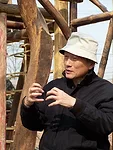 Hsieh Ying-Chun explaining his wood structure building, Beijing.