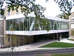 The new structure creates a large, horizontal box at the second floor, while providing on lower levels an auditorium and critique space. 