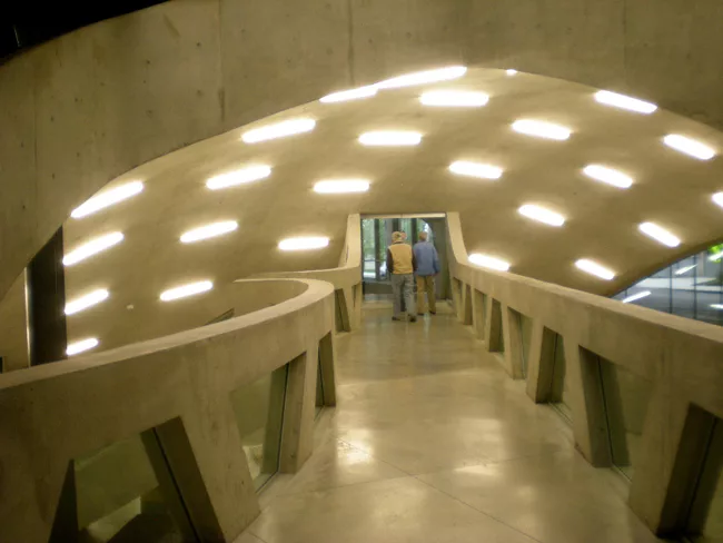 A walkway takes visitors under an interior dome to the building's auditorium.