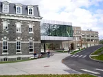 The new structure connects two existing buildings, Sibley Hall (left) and Rand Hall (right). 