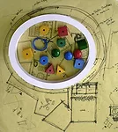 Study model for El Porvenir kindergarten, made of white cardboard, children's wooden beads, and plastic cord over tracing paper.