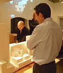 SFMOMA director Neal Benezra watches as Sn'hetta principal Craig Dykers presents a model of the project at the firm's New York office.
